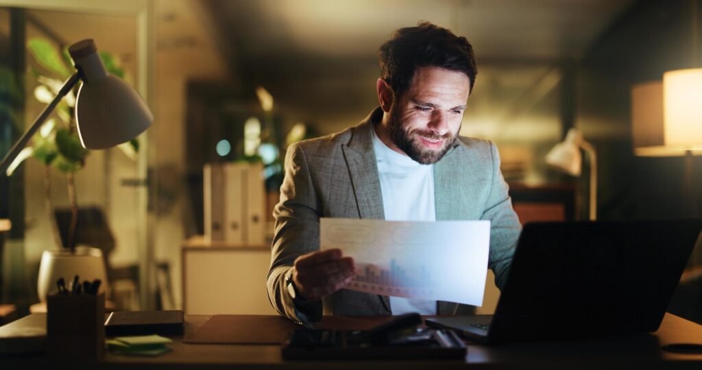 selling business - Laptop planning and documents with business man in office for night account grap